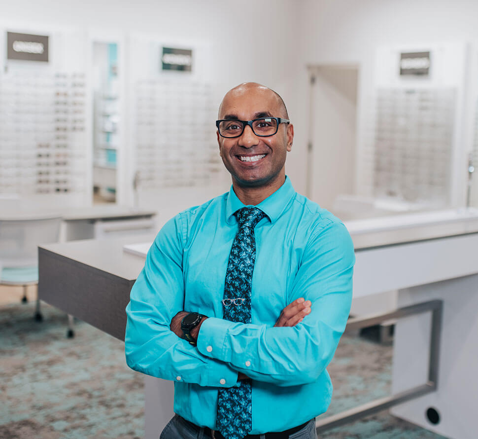 Dr. Nick Lillie smiling and pointing to the right