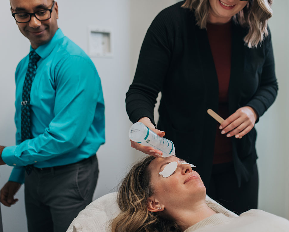 Eye doctor and patient discussing dry eye treatment plan options at Rejuvenation in MI