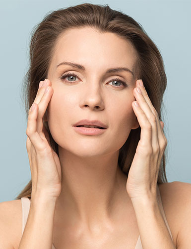 Woman touching her face