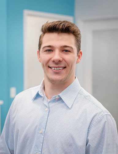 Portrait of Dr. Nick Lillie, Clinical Lead at Rejuvenation Dry Eye Center, smiling in a professional setting.
